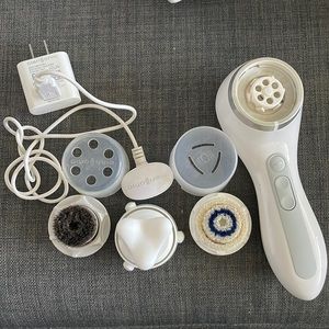Clarisonic smart profile with neck massage attachment and Lux brush head.